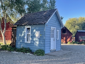 Outside of the Violet Cottage- sitting porch coming soon