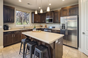 Kitchen Area with Appliances & Island in the middle