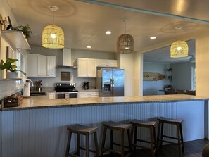 Open, airy kitchen with updated modern appliances