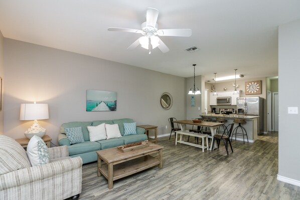 Expansive social hub with a gourmet kitchen, formal dining area, and plush living room