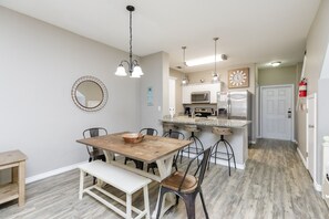 Open-concept layout connecting the dining area to the kitchen