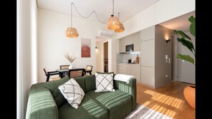 Main area with a fully equipped kitchenette, dining area for 4, a comfortable sofa and a flat screen TV. #dining #kitchen #livingroom #lovelystay