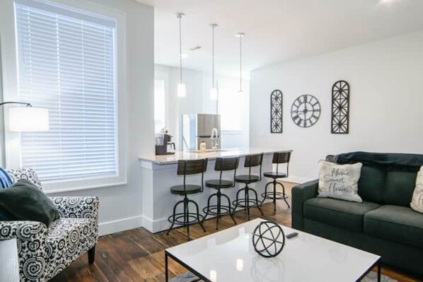 Stunning living room and kitchen. Stylish and comfortable!