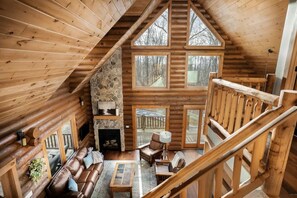 Beautiful natural light and sunsets shine through the large 2 story windows 