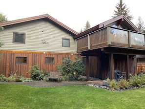 protected patio and landscaped flat lawn