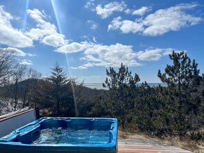 Hot tub on lower deck with view 