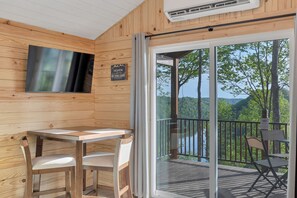 Nature cabin dining area.  Additional chairs are stored in the bedroom.