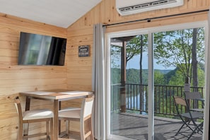 Nature cabin dining area.  Additional chairs are stored in the bedroom.