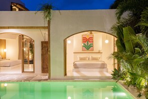 bedroom with pool in front