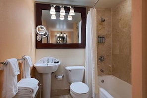 Full bathroom with a bath tub. Basic toiletries and towels are provided