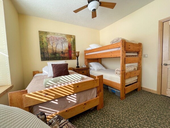 Step into this cozy bedroom, where rustic charm meets comfort with wooden bunk beds and ample natural light. You will appreciate the serene artwork and soothing ambiance, making it a perfect retreat for relaxation and rest. (Full Bed and Bunk bed)