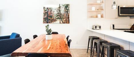 Dining room with local artwork and beautiful live edge dining table