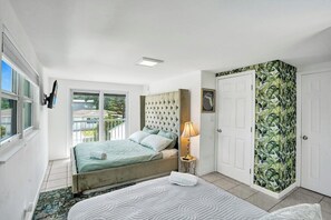 Bedroom four comes filled with a luxe king bed and a queen bed
