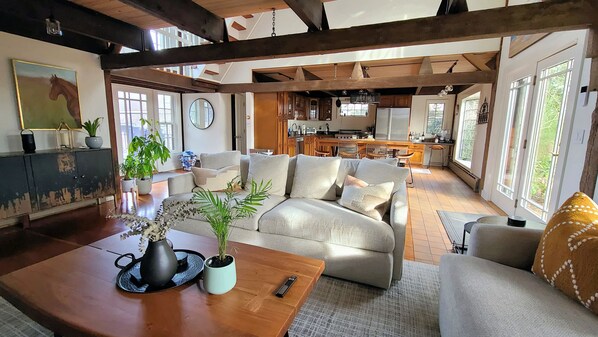 Comfortable living room with kitchen beyond