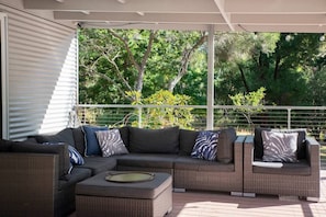 Spacious outdoor lounge: sink into comfortable chairs, unwind.