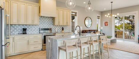 Our spacious kitchen with an island is perfect for cooking and entertaining.