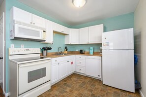 The full-size appliances and well stocked cabinets provide all the comforts of home