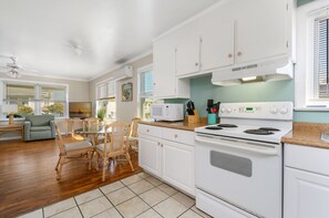 The living room flows right to the dining area and kitchen keeping the family together