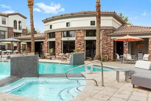 Pool, jacuzzi hot tub, and cabana seating  awaits!