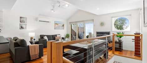 High pitched ceilings invite natural light into the main upper level