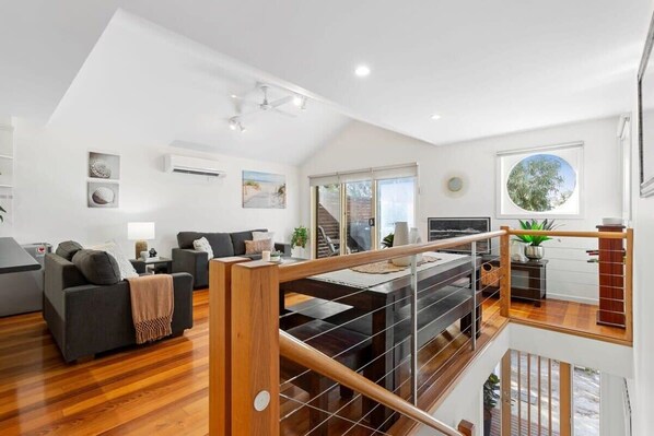 High pitched ceilings invite natural light into the main upper level