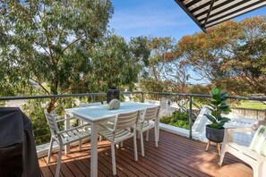 Elevated north-facing deck amongst the gum trees (traffic noise will be evident on main road)