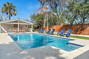 Backyard includes a heated private pool and tiki bar for your friends and family
