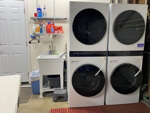 2 LG Washers & 2 LG Dryers.  Additional Large Capacity Dryer on opposite side.