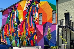 Look for the award winning mural - the painted horses - welcoming you to NULU Marketplace. Vibrance and excitement await!