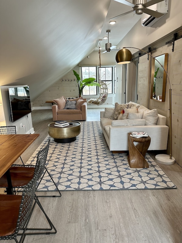 Cozy open plan living/dining/kitchen area with views to the fenced in back yard