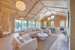 Cozy seating area perfect for lounging, surrounded by large windows for natural light.