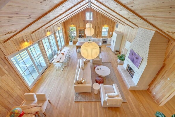 Stunning open-plan living area with vaulted ceilings and abundant natural light.