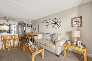 There is plenty of seating for the family to cozy in and enjoy quality time in this open living space