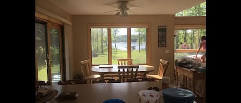 Open kitchen /dining room with log table and chairs