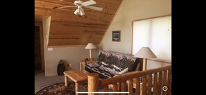 Loft area overlooking great room with futon bed 