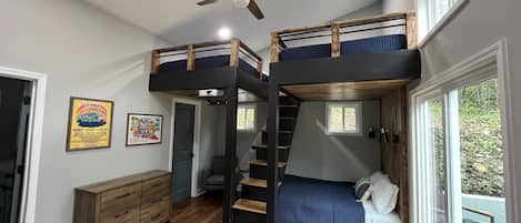 Spacious bunk room with three Queen beds.