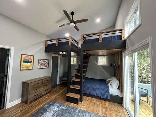 Spacious bunk room with three Queen beds.