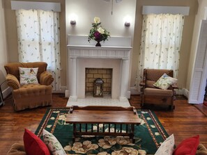 Living room with smart TV added to mantel. 