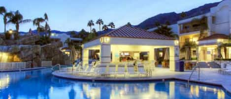 Beautiful night view of the poolside bar and pool