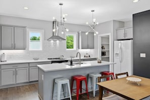 Fully stocked kitchen with Island and Chairs