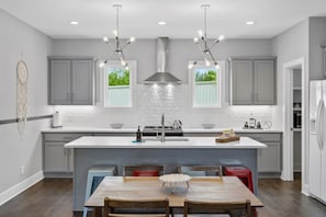 Fully stocked kitchen with Island and Chairs