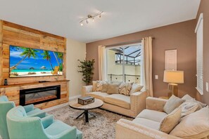 Living Room with 70" Smart TV#Disney #Parks #kingdom #springs #StoreyLake #Apartment #Vacation #Rental #waterpark #Kissimmee #Orlando #universal #citywalk