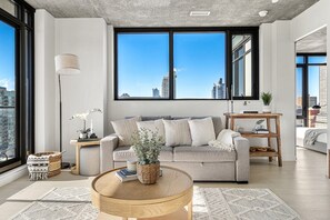 Warm and welcoming living space offering stunning views of Calgary, a sofa bed and open floor plan, perfect for socializing with your group. 