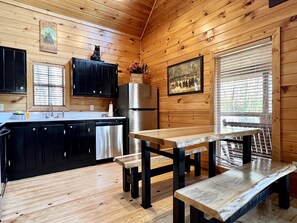 Fully loaded & updated kitchen. Beautiful wood table and benches