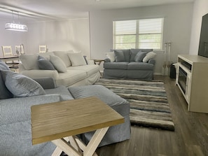 Living room has a pull-out Queen sleeper sofa.