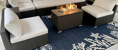 Beautiful patio furniture and fire pit for outdoor gatherings.