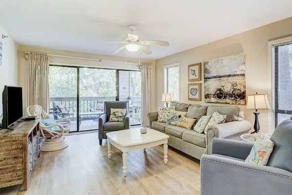 Sofa, 2 reclining chairs, swivel rocking chair, cable tv and board games