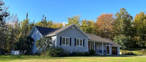 Enjoy the huge sunny front yard playing games or exploring the granite trails.