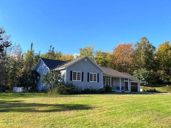 Enjoy the huge sunny front yard playing games or exploring the granite trails.