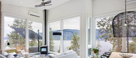 Pellet stove and floor to ceiling windows for a beautifully relaxing view